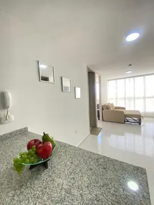 a bowl of fruit on a counter in a room at Hermoso apartamento amoblado in Barranquilla