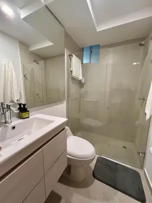 a bathroom with a sink and a toilet and a shower at Apto de lujo para estrenar in Barranquilla