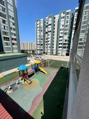 a playground on a building with tall buildings at Cómodo apartamento en el norte de Barranquilla in Barranquilla