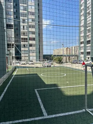 a soccer field in a city with tall buildings at Cómodo apartamento en el norte de Barranquilla in Barranquilla