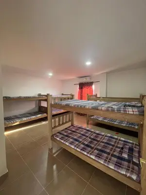 a room with several bunk beds in it at Cabaña Don Jerónimo in Santa Veronica
