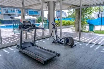 a gym with a treadmill and an exercise bike in a room at Apartamento con vista al mar - Condominio Zazué in Santa Marta