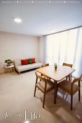 a living room with a table and a couch at Suite Elite Barranquilla in Barranquilla