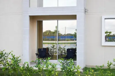 two chairs sitting in front of a window at Comfortable apartment close to the beach 2 rooms in Cartagena de Indias