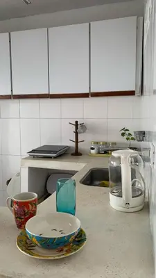 a kitchen counter with a plate and a tea kettle at Apartamento Ciudad Jardin Barranquilla in Barranquilla