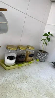 a shelf with four jars of food on a counter at Apartamento Ciudad Jardin Barranquilla in Barranquilla