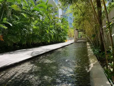 a stream of water with trees and a building at Luxury, Central y Exclusivo1 Linea Playa Privada in Cartagena de Indias