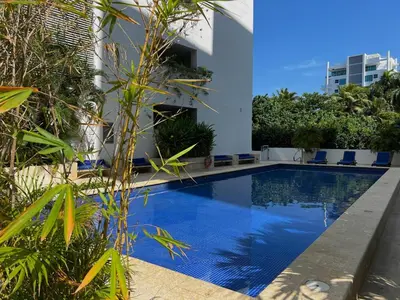 a swimming pool in front of a building at Luxury, Central y Exclusivo1 Linea Playa Privada in Cartagena de Indias
