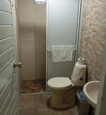 a bathroom with a shower and a toilet and a sink at 5 minutos del Castillo san Felipe in Cartagena de Indias