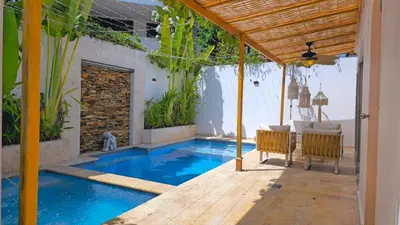a swimming pool in the middle of a house at Spectacular Villa Near Walled City in Cartagena de Indias