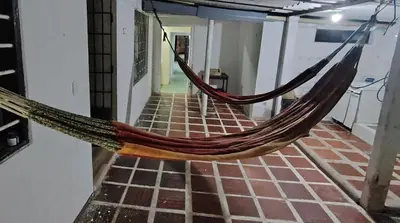 a hammock in the hallway of a room at Casa yamulemao in Cartagena de Indias