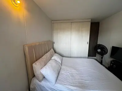 a bedroom with a bed with two pillows on it at Modern and cozy apartment at north in Barranquilla