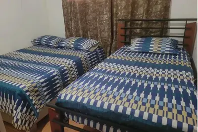 two beds sitting next to each other in a room at Hospedaje Refugio del Caribe in Cartagena de Indias