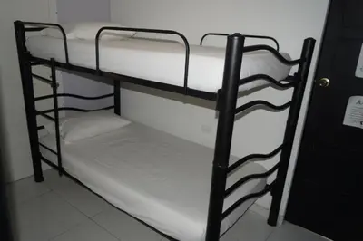 a couple of bunk beds in a room at Hotel Mar di Plata in Barranquilla