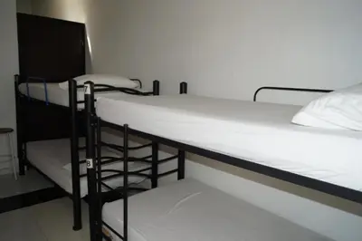 a couple of bunk beds in a room at Hotel Mar di Plata in Barranquilla