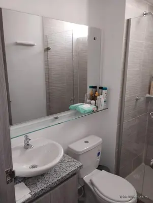 a bathroom with a toilet and a sink and a shower at Apto Nuevo Mallorquín Barranquilla in Barranquilla