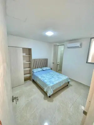 a bedroom with a bed in a room at Apartamento nuevo a 300 mts malecón del rio in Barranquilla
