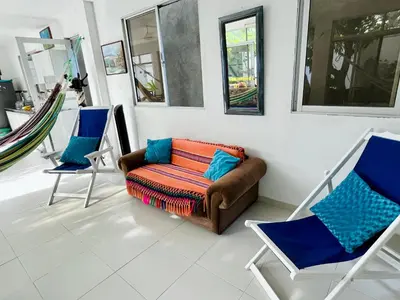 a living room with a couch and two chairs at Refugio playero - A pasos del Mar in La Siriaca