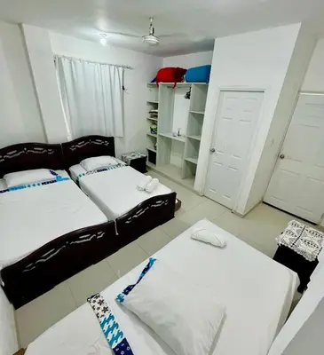 a living room with two beds and a closet at Refugio playero - A pasos del Mar in La Siriaca
