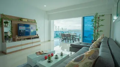 a living room with a couch and a tv at Aparamento Vista Mar 1703 in Cartagena de Indias