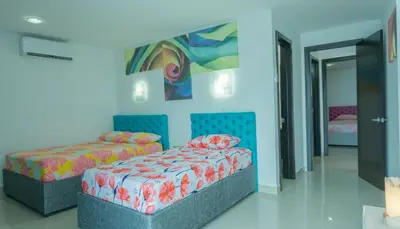 a room with two beds and a couch at Aparamento Vista Mar 1703 in Cartagena de Indias