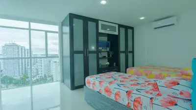 a bedroom with a bed and a large window at Aparamento Vista Mar 1703 in Cartagena de Indias