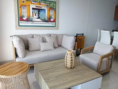 a living room with a couch and a table at Altamar vista al mar in Cartagena de Indias