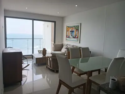 a living room with a glass table and a couch at Altamar vista al mar in Cartagena de Indias