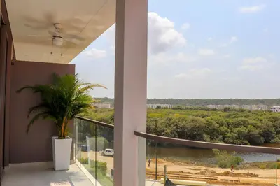 a balcony with a view of a river and trees at Apartamento Morros C28 acceso directo al Mar Manzanillo in Cartagena de Indias