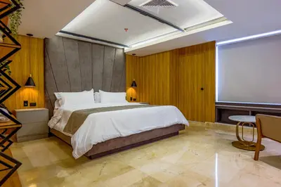 a bedroom with a large bed and a large window at Del Mar City View in Cartagena de Indias