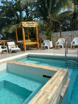 a pool with a gazebo and a table and chairs at Paradise BH in Maizal