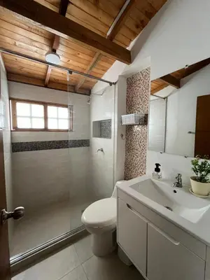 a bathroom with a toilet and a shower and a sink at Paradise BH in Maizal
