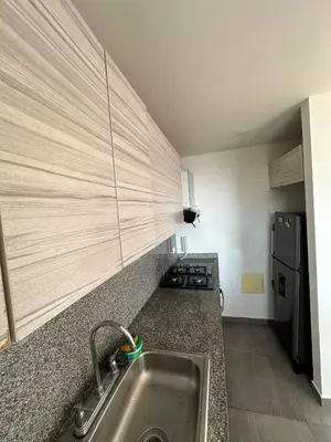 a kitchen with a sink and a counter top at ApartaEstudio in Barranquilla