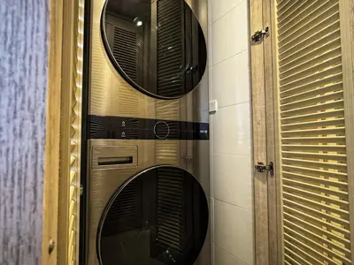 two round mirrors on the wall of a room at Exclusivo apartamento con Piscina Privada in Cartagena de Indias