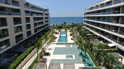 an aerial view of a resort with a swimming pool and the ocean at Exclusivo apartamento con Piscina Privada in Cartagena de Indias