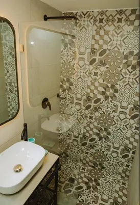 a bathroom with a sink and a shower at Laguito Houstel Small in Cartagena de Indias