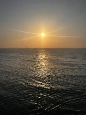 a sunset over the ocean with the sun setting at HERMOSO APARTAMENTO VISTA AL MAR PALMETTO SUNSET-El Laguito in Cartagena de Indias