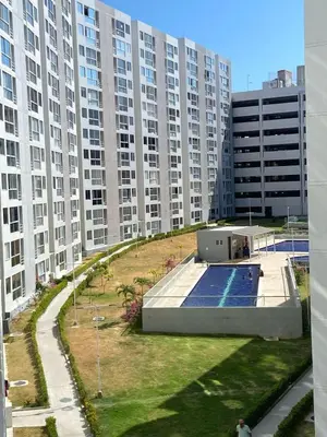 a large building with a swimming pool in front of it at Lindo apartamento en el norte in Barranquilla