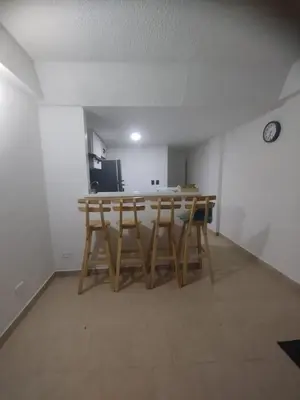 a kitchen with a table and chairs in a room at Duplex playa y mar in Cartagena de Indias