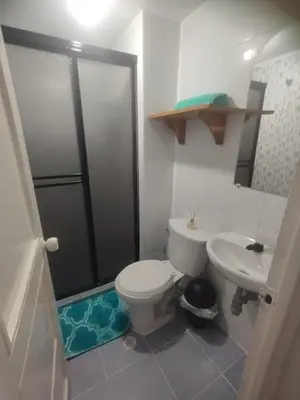 a bathroom with a toilet and a sink at Duplex playa y mar in Cartagena de Indias