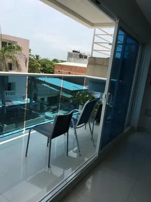 two chairs and a table on a balcony at Valmar apartamentos in Cartagena de Indias