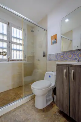 a bathroom with a toilet and a shower at Bololá Hotel in Cartagena de Indias