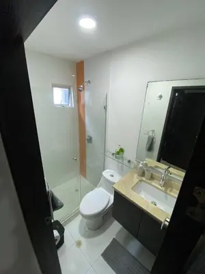 a bathroom with a toilet and a shower and a sink at Modern Duplex en Riomar BQuilla in Barranquilla