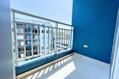 a balcony with a view of a blue wall at Apartmento En Miramar in Barranquilla