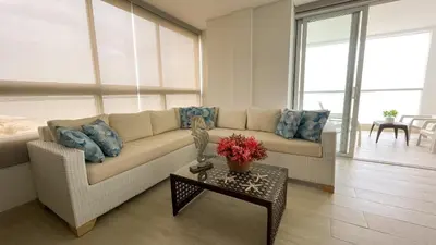 a living room with a couch and a table at Magico Apartamento Frente al Mar 3 Habitaciones TV52 in Coveñas