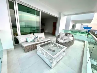 a living room with a couch and a coffee table at Lovely apartment in front the beach in Coveñas