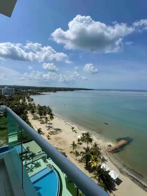 a view of the beach from the balcony of a resort at Lovely apartment in front the beach in Coveñas