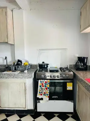 a kitchen with a stove and a sink at Cuatro Palmas Beach House in Cartagena de Indias