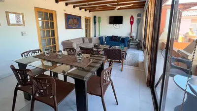a living room with a table and chairs and a couch at Nautilus urban loft in Cartagena de Indias