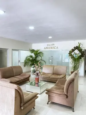 a living room with couches and tables in a store at Hotel Continental Plaza Barranquilla in Barranquilla
